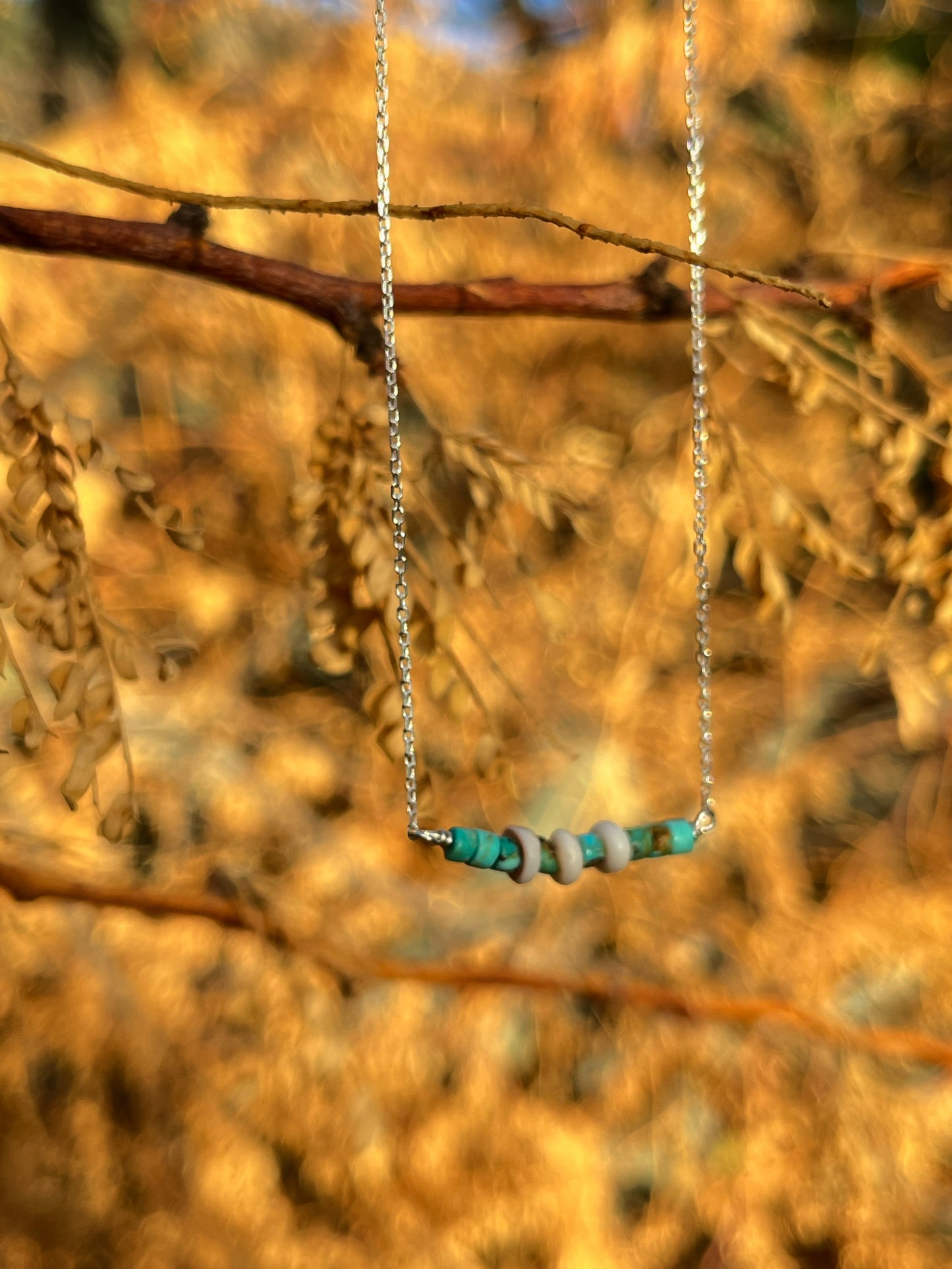 The Merchant Necklace in puka shell