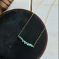 The Merchant Necklace in puka shell