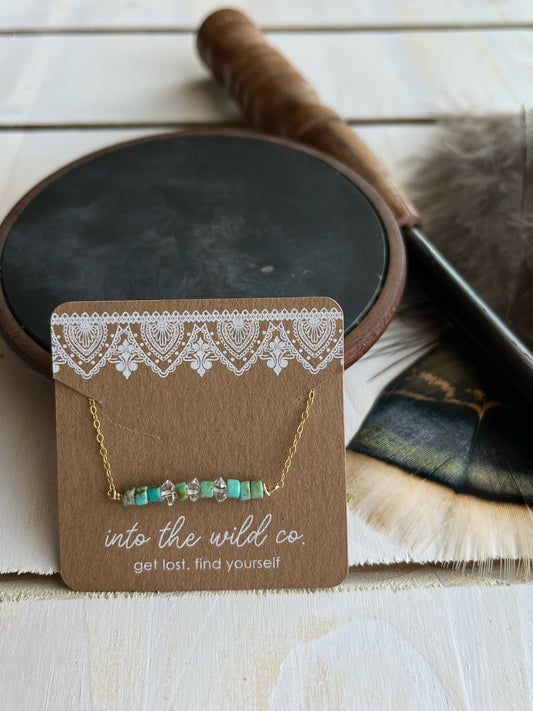 The Merchant Necklace in puka shell or herkimer diamond